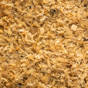 Fine hardwood sawdust wood waste ready for processing into biomass briquettes.