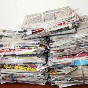 Bundled paper waste and newspapers utilized as raw material for briquette making